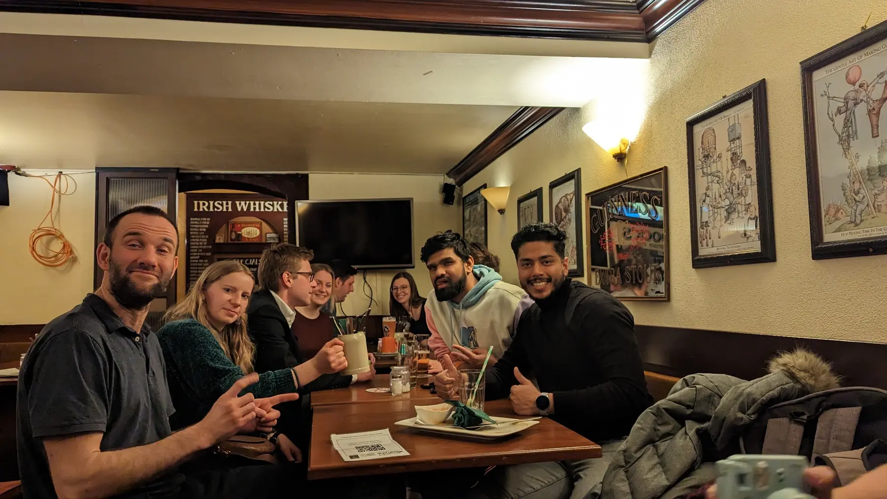 Friends meeting around a pub table