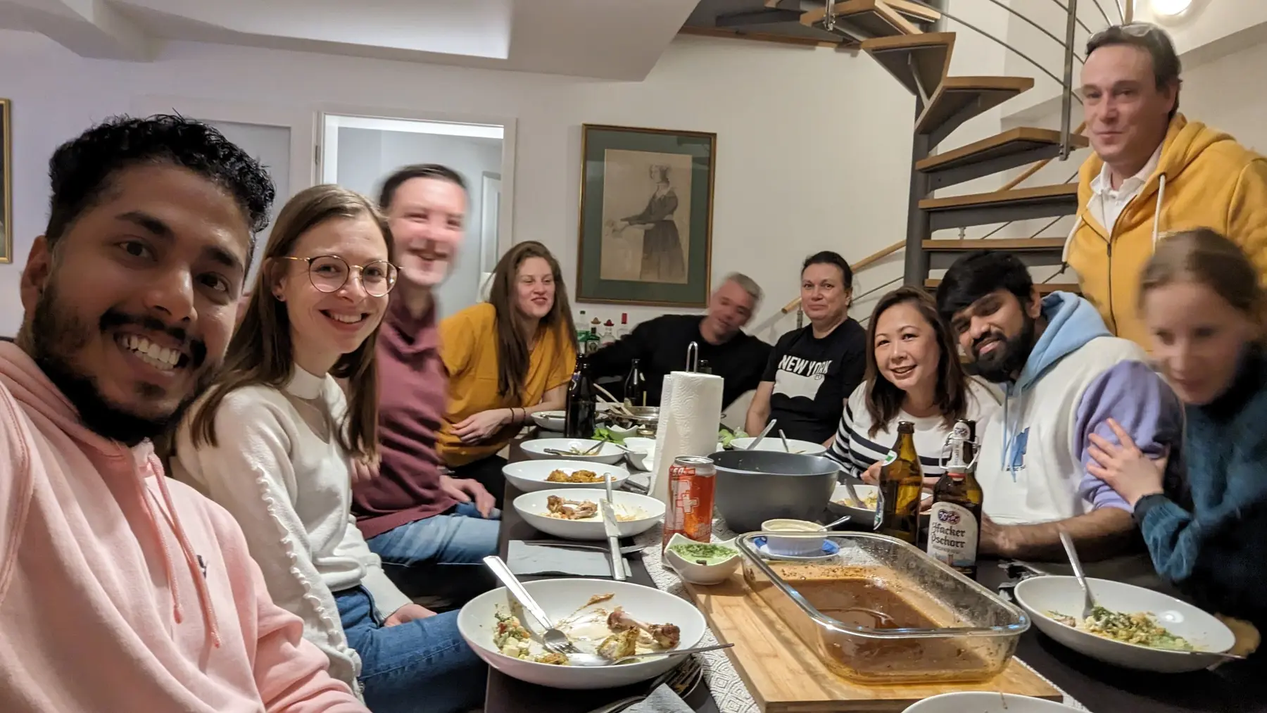 People talking over a shared dinner