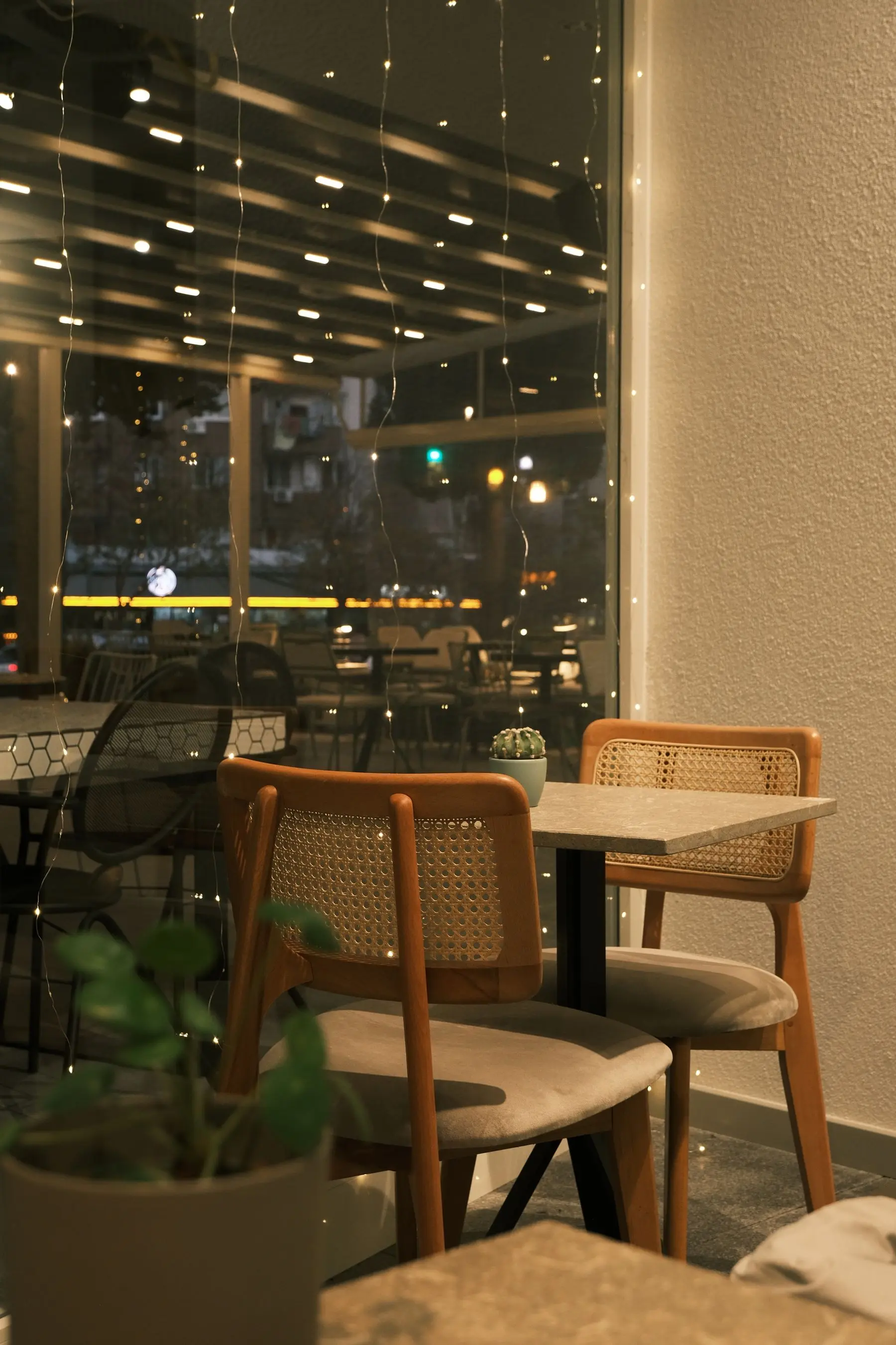 An inviting empty cafe table with two chairs